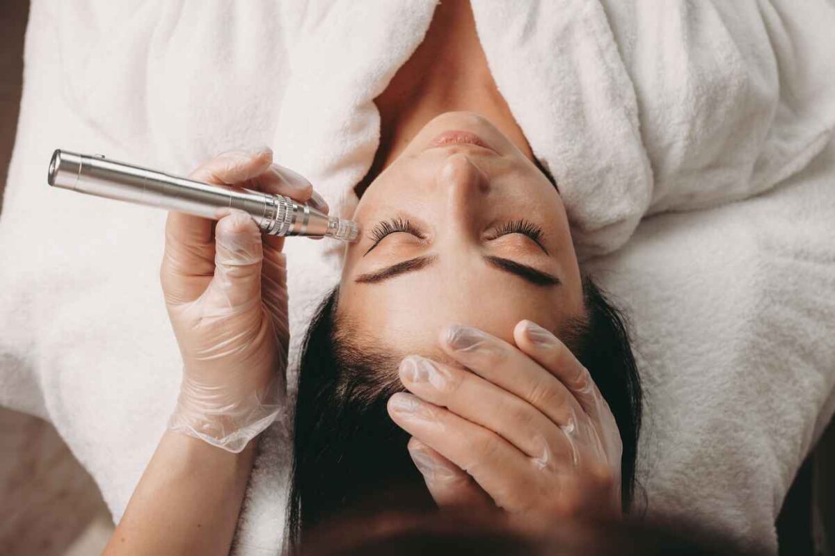 Caucasian woman having an anti aging procedure with modern apparatus during a spa session